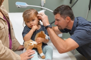 doctor checking a child's ear